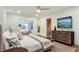 Main bedroom with wood dresser and en-suite bathroom at 3645 Mirror Lake Dr, Apopka, FL 32703