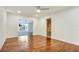 Hardwood floors and an open door to the bathroom at 3645 Mirror Lake Dr, Apopka, FL 32703