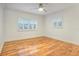 Spacious bedroom with hardwood floors and white walls at 3645 Mirror Lake Dr, Apopka, FL 32703