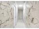 Clean hallway with marble wall and white flooring at 3645 Mirror Lake Dr, Apopka, FL 32703