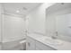 Bathroom with a shower-tub combination, white cabinets, and a large mirror at 3801 Giorgio Dr, Winter Haven, FL 33884