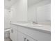 Bathroom featuring a single sink vanity with bright white cabinets and stone countertops at 3801 Giorgio Dr, Winter Haven, FL 33884