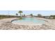 Resort-style pool with lounge chairs and shade structures at 3801 Giorgio Dr, Winter Haven, FL 33884