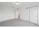 Cozy bedroom featuring neutral carpeting and a double door closet at 3833 Giorgio Dr, Winter Haven, FL 33884