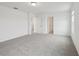 Expansive bedroom featuring neutral carpeting and a doorway at 3833 Giorgio Dr, Winter Haven, FL 33884