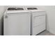 Modern laundry room with Whirlpool washer and dryer at 3833 Giorgio Dr, Winter Haven, FL 33884