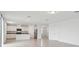 Open-concept living room featuring tile flooring, recessed lighting, and a seamless flow into the modern kitchen at 3833 Giorgio Dr, Winter Haven, FL 33884