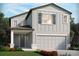 Two-story home with gray siding, brown roof, and a two-car garage at 3852 Giorgio Dr, Winter Haven, FL 33884