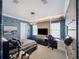 Modern bedroom featuring geometric blue wallpaper, sleek furniture, and plenty of natural light at 4089 Isabella Cir, Windermere, FL 34786