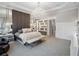 This main bedroom has a crystal chandelier, custom shelving, and a seating area with soft, luxurious textures at 4089 Isabella Cir, Windermere, FL 34786