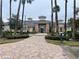 Elegant community clubhouse with lush landscaping and a welcoming entrance at 4220 Cleary Way, Orlando, FL 32828