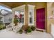 Covered porch with white wicker chairs and potted plants at 4220 Cleary Way, Orlando, FL 32828