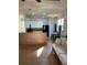 Open concept living room with bright white cabinets, tile floors, a breakfast bar, and dining area at 4220 Cleary Way, Orlando, FL 32828