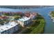 An aerial view of a waterfront condominium complex with stunning views of the river and surrounding coastal landscape at 432 Bouchelle Dr # 102, New Smyrna Beach, FL 32169