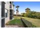 Landscaped backyard with water views and lush greenery at 432 Bouchelle Dr # 102, New Smyrna Beach, FL 32169