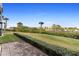 Nice backyard with lush landscaping and water views at 432 Bouchelle Dr # 102, New Smyrna Beach, FL 32169