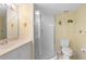 Bathroom with shower, toilet, and vanity with a mirror at 432 Bouchelle Dr # 102, New Smyrna Beach, FL 32169