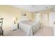 Bedroom with queen-size bed and access to bathroom at 432 Bouchelle Dr # 102, New Smyrna Beach, FL 32169