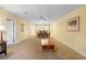 Bright dining room with a table and chairs, view of kitchen at 432 Bouchelle Dr # 102, New Smyrna Beach, FL 32169