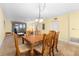 Dining room featuring a wood table and six chairs at 432 Bouchelle Dr # 102, New Smyrna Beach, FL 32169