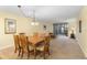 Bright dining room with wood table and six chairs at 432 Bouchelle Dr # 102, New Smyrna Beach, FL 32169