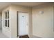 Condo entry with white door and window at 432 Bouchelle Dr # 102, New Smyrna Beach, FL 32169