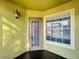 Exterior entry with window and door, yellow walls at 445 Fountainhead Cir # 164, Kissimmee, FL 34741