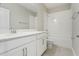 Modern bathroom with a single vanity, white cabinets, and a shower-tub combo at 5003 Railroad Vine Aly, Winter Garden, FL 34787