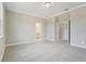 Spacious neutral bedroom with carpet and a view into the bathroom at 5003 Railroad Vine Aly, Winter Garden, FL 34787
