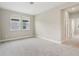 Neutral bedroom offers natural light with two windows and a neutral color scheme at 5003 Railroad Vine Aly, Winter Garden, FL 34787