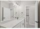Bright bathroom featuring modern fixtures and finishes, and a view to the laundry area at 5087 Railroad Vine Aly, Winter Garden, FL 34787