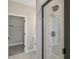 Bathroom with a walk-in closet and an elegant glass shower at 5087 Railroad Vine Aly, Winter Garden, FL 34787