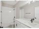 Bright bathroom featuring white countertops and white tiled shower and tub at 5087 Railroad Vine Aly, Winter Garden, FL 34787