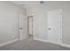 Bedroom featuring neutral walls, carpet, and doors leading to other parts of the house at 5087 Railroad Vine Aly, Winter Garden, FL 34787