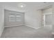 Bright and airy bedroom with plush carpet, neutral walls, large window with natural light at 5087 Railroad Vine Aly, Winter Garden, FL 34787