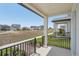 View from the front porch with dark railing and nice landscaping at 5087 Railroad Vine Aly, Winter Garden, FL 34787