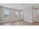 Bright living room featuring wood floors, recessed lighting, and natural light through the windows at 5087 Railroad Vine Aly, Winter Garden, FL 34787