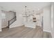The floor plan features an open living area with a modern kitchen, dining space, and staircase at 5087 Railroad Vine Aly, Winter Garden, FL 34787