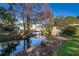 Peaceful backyard setting, showcasing a canal and dock at 5416 Parkway Dr, Belle Isle, FL 32809