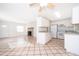 Bright kitchen with white cabinets and gray countertops at 5416 Parkway Dr, Belle Isle, FL 32809