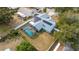 House with solar panels, pool, and fenced backyard at 5535 Long Lake Dr, Orlando, FL 32810