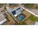 Home with a screened pool and solar panels on the roof at 5535 Long Lake Dr, Orlando, FL 32810