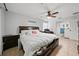 Bright bedroom with king-size bed and ensuite bathroom at 5535 Long Lake Dr, Orlando, FL 32810