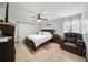 Spacious bedroom with tiled floors and ceiling fan at 5535 Long Lake Dr, Orlando, FL 32810