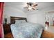 Spacious bedroom with king-size bed and wood flooring at 5535 Long Lake Dr, Orlando, FL 32810