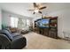 Relaxing living room with large TV and comfortable seating at 5535 Long Lake Dr, Orlando, FL 32810