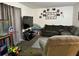 Cozy living room features neutral tones, a sectional couch, and a TV at 5885 Dahlia Dr # 24, Orlando, FL 32807