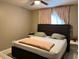 Comfortable bedroom with soft lighting and neutral tones at 5885 Dahlia Dr # 31/116, Orlando, FL 32807