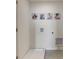 Bright laundry room with white walls and tiled floors at 6610 Leo Ln, St Cloud, FL 34773