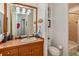 Bathroom with wood vanity, mosaic tile, and a shower/tub combo at 6874 Valhalla Way, Windermere, FL 34786